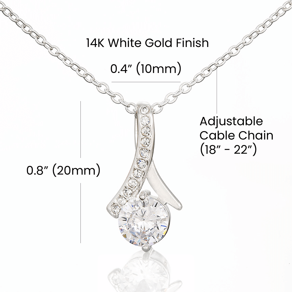 Alluring Beauty Petite Ribbon Shaped Pendant in 14k White Gold Finish or 18k Yellow Gold Finish over Stainless Steel with a 7mm Cubic Zirconia (No Message Card)