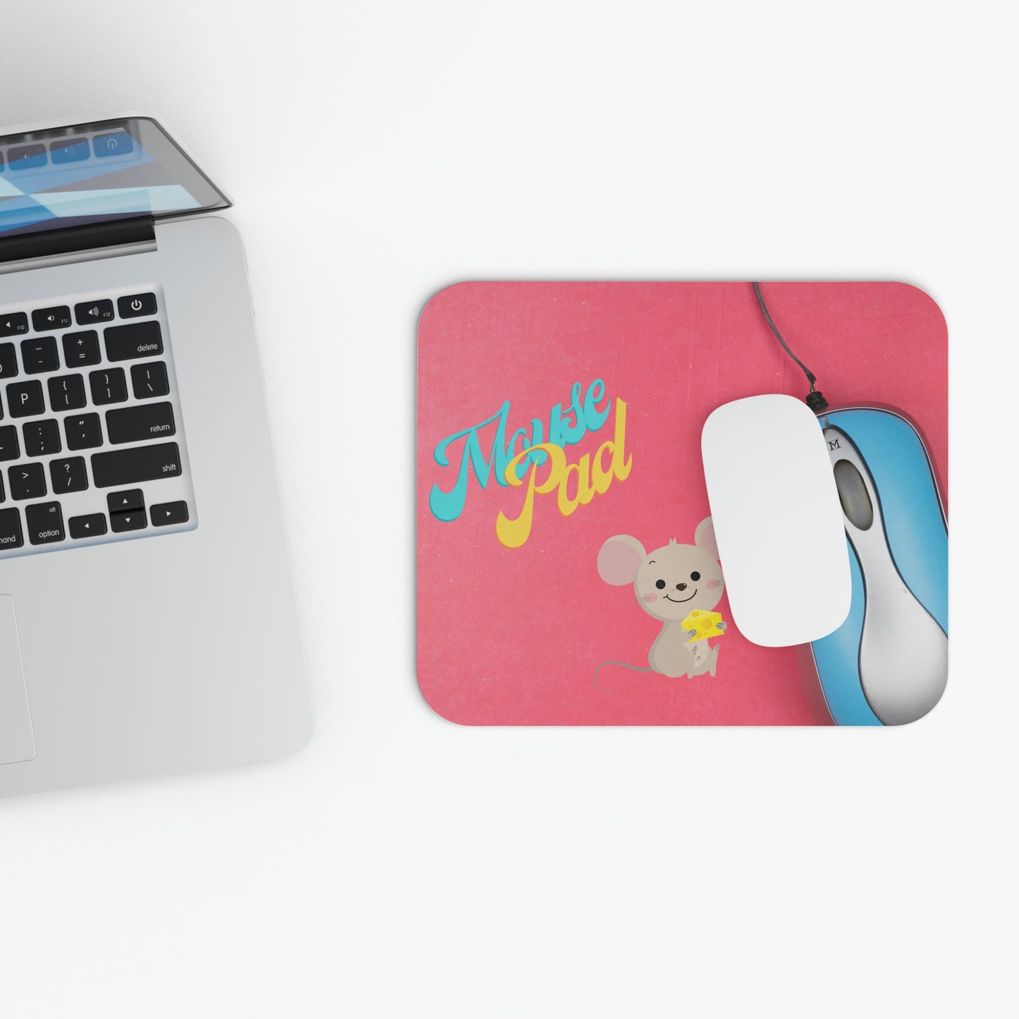 Blue Yellow Pink Mouse Pad with Real Mouse Beside a Blue and Silver Computer Mouse