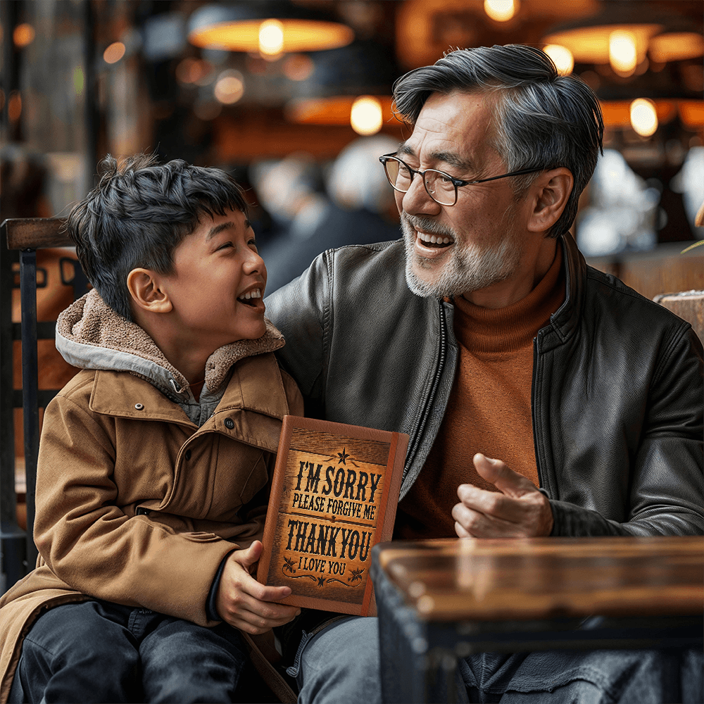 Ho'Oponopono Healing and Clearing Journal Shown with Older Male and Male Child smiling and laughing together.
