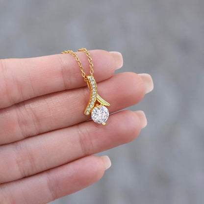 Alluring Beauty Petite Ribbon Shaped Pendant in 14k White Gold Finish or 18k Yellow Gold Finish over Stainless Steel with a 7mm Cubic Zirconia (No Message Card)