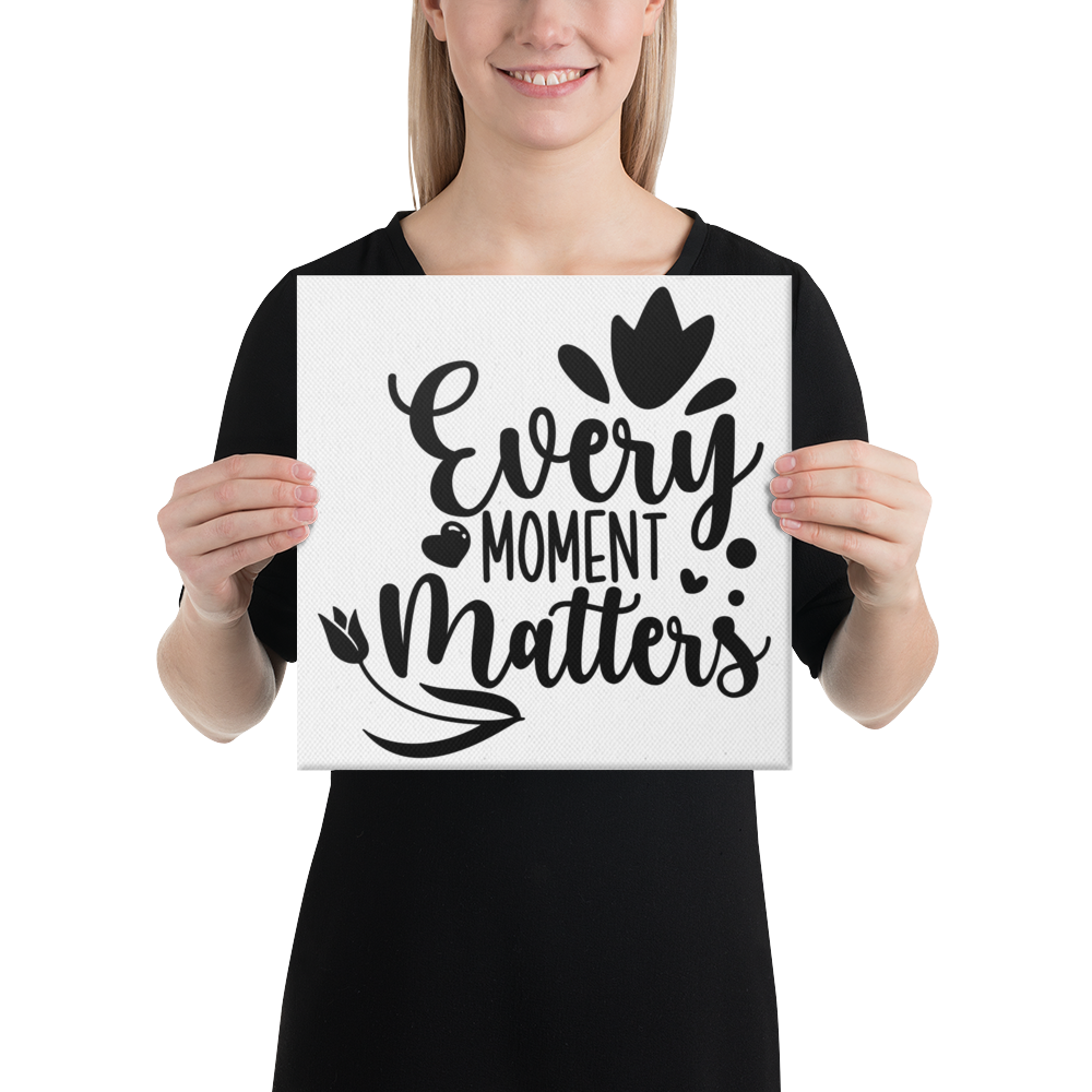 Every Moment Matters Square Canvas 12"x12" woman holding canvas at chest height