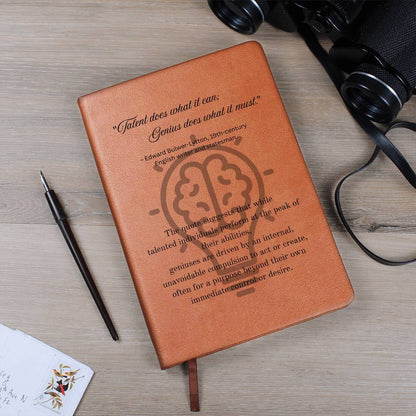 Notebook journal with cover quote: Edward Bulwer-Lytton's "Talent does what it can; Genius does what it must." black text layered on a lightbulb on the brown vegan leather cover.